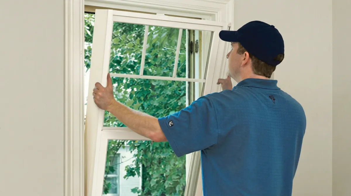 Professional contractors performing a residential window insulation and replacement service in San Diego, CA